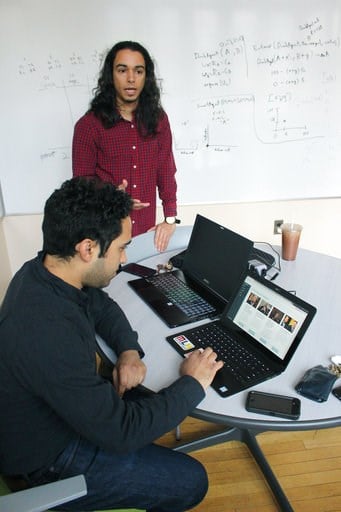 (AP Photo/Pat Eaton-Robb). In this Dec. 13, 2017, photo graduate students Michael Lopez-Brau, back, and Stefan Uddenberg show off the internet browser extension "Open Mind," at Yale University in New Haven, Conn. The pair helped create the extension wi...