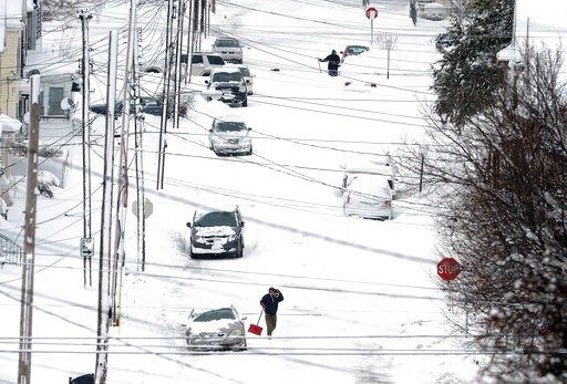 Erie smashes snowfall record with flakes still falling