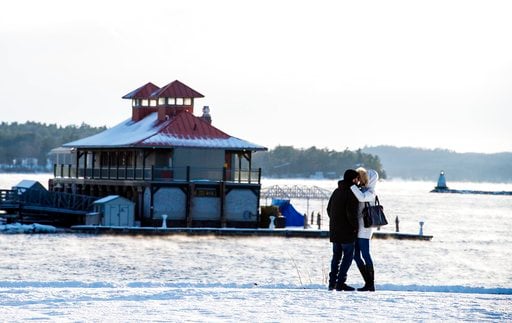 (Glenn Russell/The Burlington Free Press via AP). A couple embraces as they brave the cold weather for a walk in Waterfront Park in Burlington, Vt., Wednesday, Dec. 27, 2017. Freezing temperatures and below-zero wind chills socked much of the northern ...