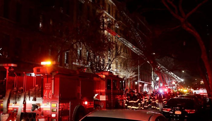 Firefighters respond to a building fire Thursday, Dec. 28, 2017, in the Bronx borough of New York. (Source: AP Photo/Frank Franklin II)
