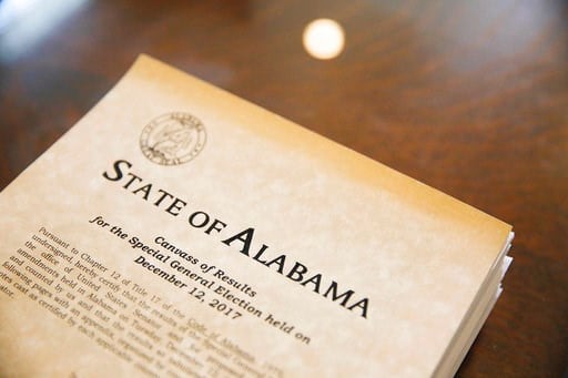 (AP Photo/Brynn Anderson). Documents to certify the 2017 Special Election for U.S. Senator sit on a table, Thursday, Dec. 28, 2017, in Montgomery, Ala. Democrat Doug Jones' historic victory over Republican Roy Moore was declared official Thursday as Al...