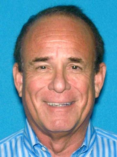 Doctor charged with having wife killed to protect drug ring