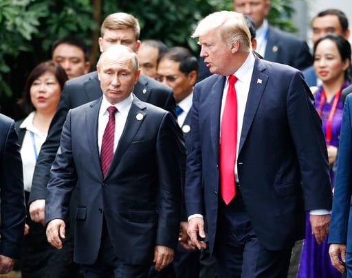 (Jorge Silva/Pool Photo via AP, File). In this Nov. 11, 2017, file photo President Donald Trump, right, and Russia's President Vladimir Putin talk during the family photo session at the APEC Summit in Danang, Vietnam.