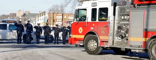 (Elizabeth Robertson/The Philadelphia Inquirer via AP). In this Saturday, Jan. 6, 2018, photo, Philadelphia police salute the procession for veteran firefighter Lieutenant Matthew LeTourneau in Philadelphia. LeTourneau was fatally injured Saturday when...