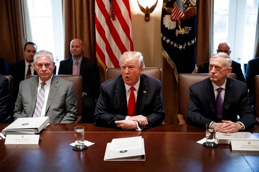 (AP Photo/Evan Vucci). Secretary of State Rex Tillerson, left, and Secretary of Defense Jim Mattis, right, listen as President Donald Trump speaks during a cabinet meeting at the White House, Wednesday, Jan. 10, 2018, in Washington.