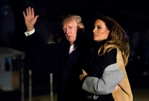 (AP Photo/Manuel Balce Ceneta). President Donald Trump with first lady Melania Trump waves as he returns to the White House in Washington, Monday, Jan. 15, 2018. Trump spent the holiday weekend at his Mar-a-Lago estate in Palm Beach, Fla.