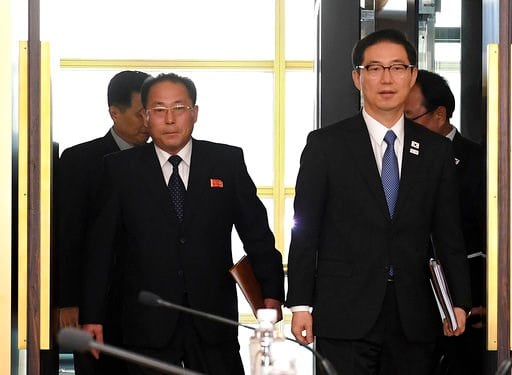 (South Korea Unification Ministry via AP). In this photo provided by South Korea Unification Ministry, South Korean Vice Unification Minister Chun Hae-sung, right, and the head of North Korean delegation Jon Jong Su arrive for their meeting at Panmunjo...