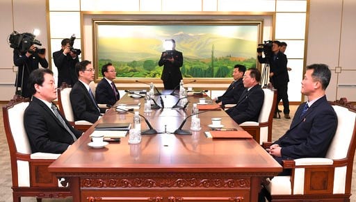 (South Korea Unification Ministry via AP). In this photo provided by South Korea Unification Ministry, South Korean Vice Unification Minister Chun Hae-sung, center left, talks with the head of North Korean delegation Jon Jong Su during their meeting at...