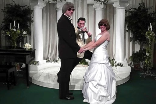 (A Elvis Chapel via AP). In this Oct. 29, 2011, image made from a video provided by A Elvis Chapel, David Allen Turpin, left, and his wife, Louise Anna Turpin, right, celebrate a renewal of their wedding vows with Elvis impersonator Kent Ripley.