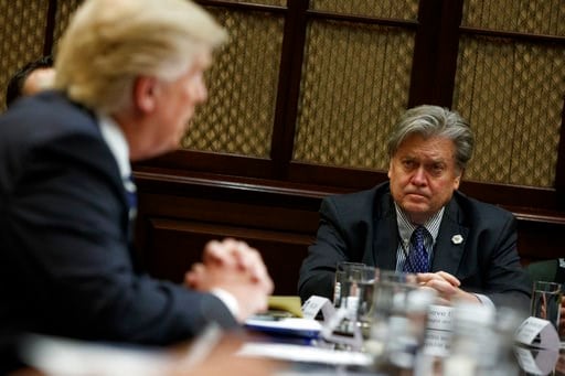 (AP Photo/Evan Vucci, File). Then-White House Chief Strategist Steve Bannon listens as President Donald Trump speaks during a meeting on cyber security in the Roosevelt Room of the White House in Washington, Tuesday, Jan. 31, 2017.