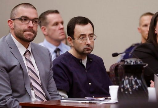 (AP Photo/Carlos Osorio). Larry Nassar sits with attorney Matt Newburg during his sentencing hearing Wednesday, Jan. 24, 2018, in Lansing, Mich.  The former sports doctor who admitted molesting some of the nation's top gymnasts for years was sentenced ...