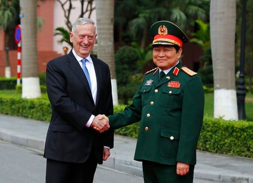 (AP Photo/Tran Van Minh). U.S. Defense Secretary Jim Mattis, left, shakes hands with his Vietnamese counterpart Ngo Xuan Lich, right, before reviewing and honor guard in Hanoi, Vietnam, Thursday, Jan. 25, 2018. Mattis is on a two-day visit to Vietnam t...
