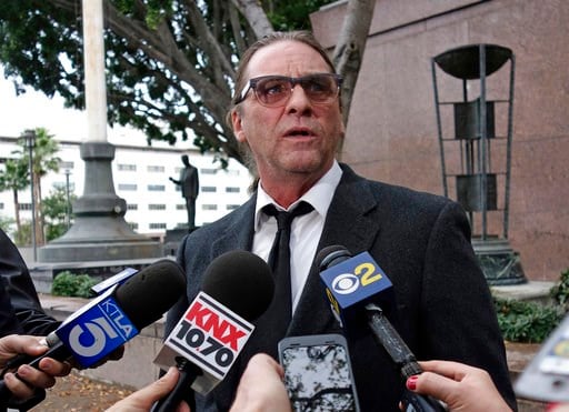 (AP Photo/Brian Melley, File). FILE - In this Jan. 8, 2018, file photo, Michael Channels speaks to reporters after a hearing in Los Angeles Superior Court. A Los Angeles judge on Friday, Jan. 26, 2018, will hear arguments on what county should decide w...