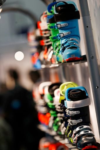 (AP Photo/David Zalubowski). Lange ski boots line a display wall in the company's booth at the opening of the Outdoor Retailers and Snow Show in the Colorado Convention Center, Thursday, Jan. 25, 2018, in Denver. Three floors of all the latest products...