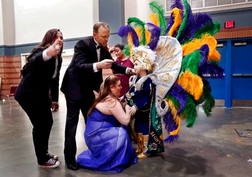 (AP Photo/Gerald Herbert). Jack Spittler III waits as his costume is adjusted before the start of the Little Rascals Mardi Gras Ball in Kenner, La., Thursday, Jan. 25, 2018. The weeks-long celebration leading up to Fat Tuesday is often perceived as an ...