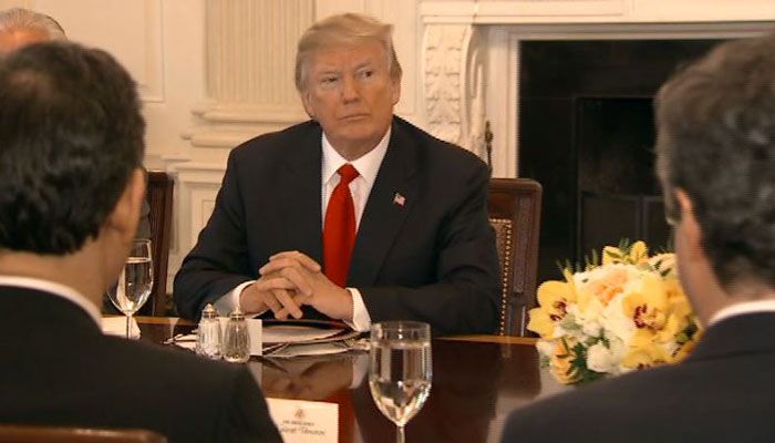 Trump warns of immigration peril, touts economy in address