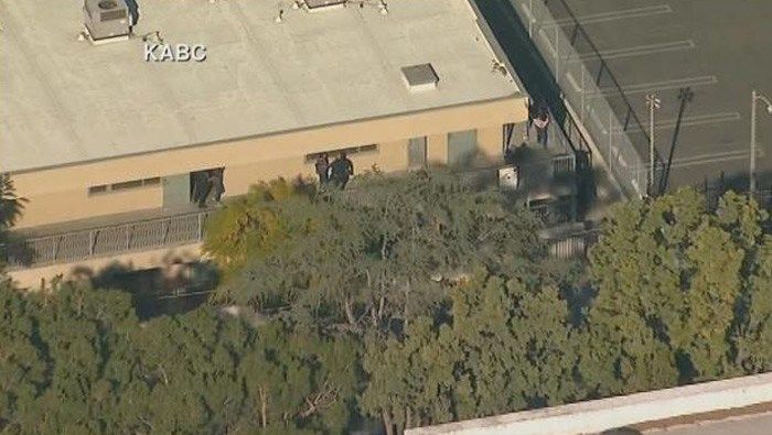 The Latest: Random weapons screening required at LA schools