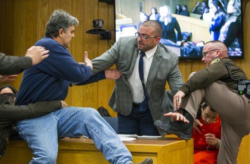 Victims' dad apologizes after lunging at Nassar in courtroom