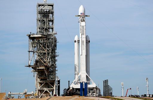 SpaceX's big new rocket blasts off with sports car on top