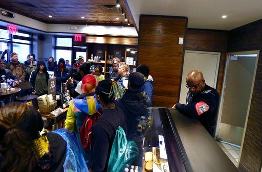 The Latest: Starbucks to close stores for bias training