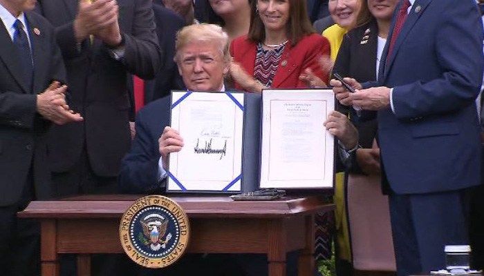 Trump signs bill to expand private care at troubled VA