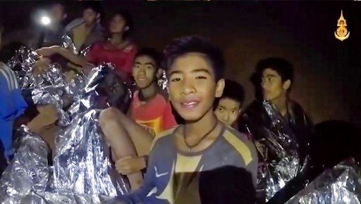 Rescuers race to drain water inside Thai cave before rains