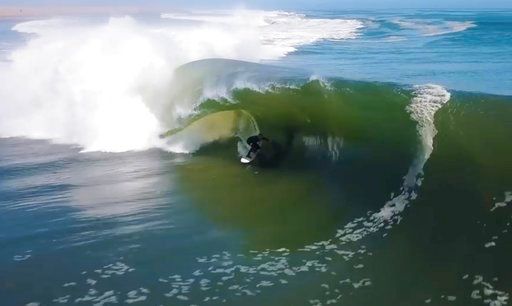 2 minutes, 8 barrels: Surfer takes an epic ride into history