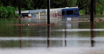 (AP Photo/Eric Gay). A San Antonio metro bus sits in floodwaters after it was swept off the road during heavy rains, Saturday, May 25, 2013, in San Antonio. (AP Photo/Eric Gay). A San Antonio metro bus sits in floodwaters after it was swept off the road during heavy rains, Saturday, May 25, 2013, in San Antonio.