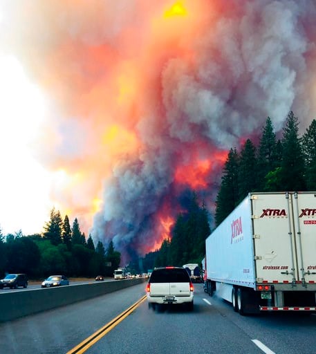 Abandoned trucks litter California highway as wildfire rages
